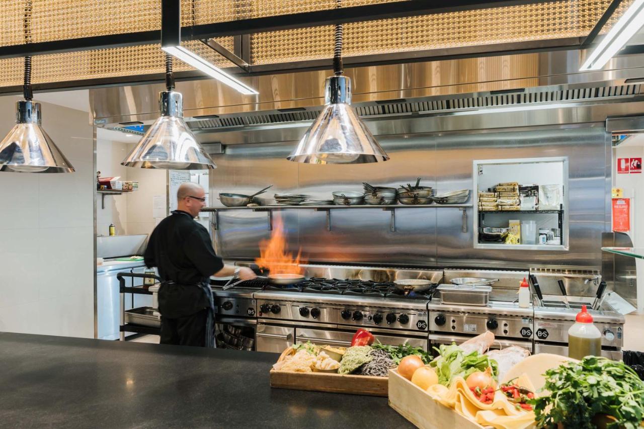 Peppers Waymouth Hotel Adelaide Exterior photo A chef working in a restaurant kitchen