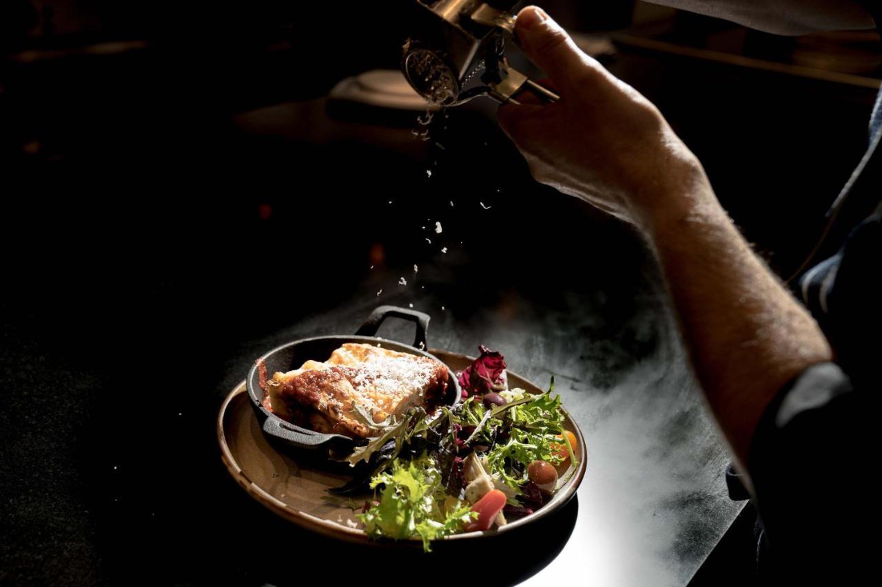 Peppers Waymouth Hotel Adelaide Exterior photo A chef seasoning a dish